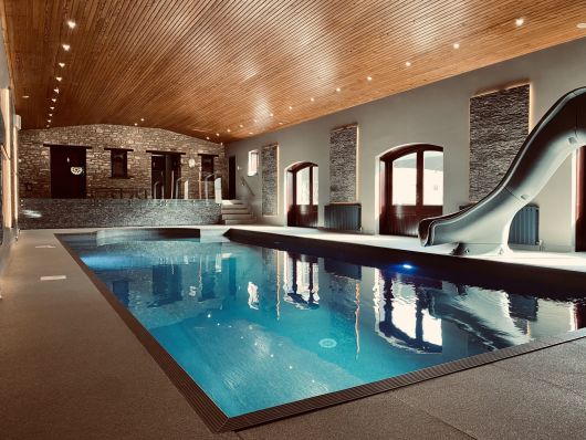 indoor pool complex wiht slide