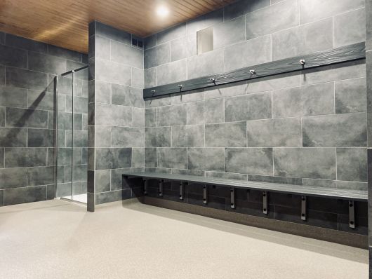 tiled shower and changing area