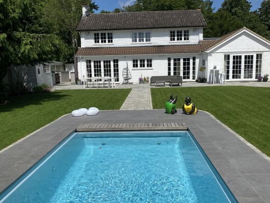 pool with house in the background