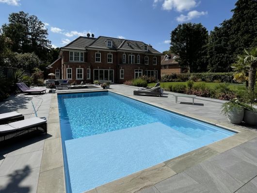 pool during the day with pool cover partially open